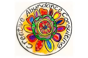 A colorful, artistic logo featuring a vibrant flower design with the words "Creative Abundance Consulting" encircling it, symbolizing growth and creativity, reflecting the Christopher Smith…| A Non Profit For Caregivers | Christopher Smith Foundation